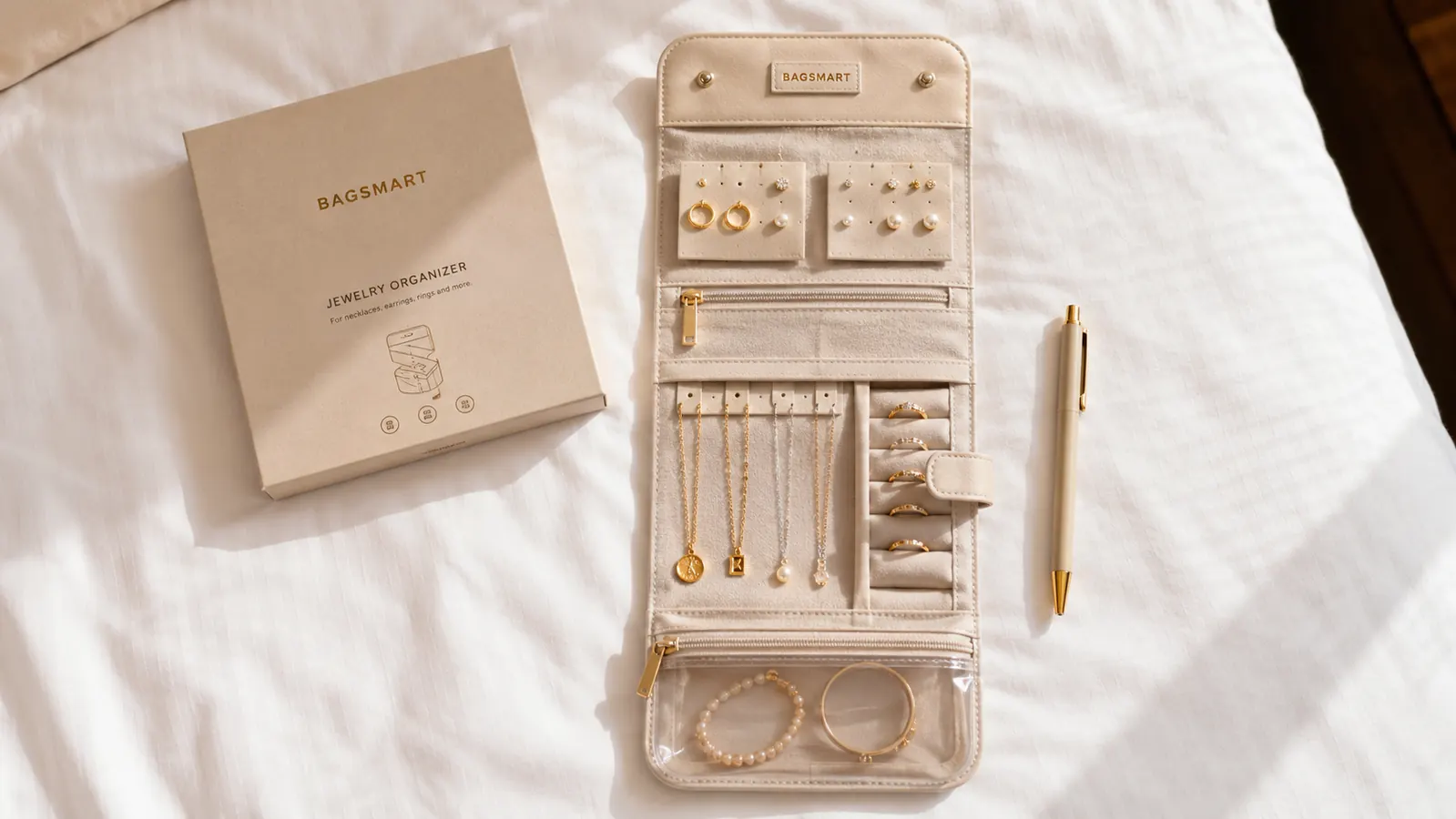 BAGSMART jewelry roll rolled up next to a quarter coin to show its compact folded size